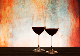 Two wine glasses on table with beautiful background