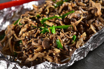 Grilled mushrooms on dark background