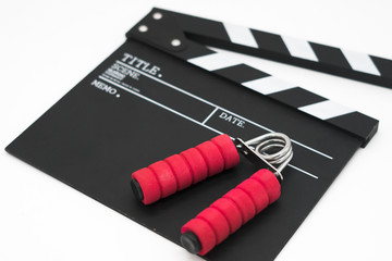 Naklejka premium Movie clapper board and spring grip.