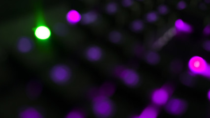 Night dark background bokeh, neon light, blurred background, light effect night view. Dark abstract background, laser glare.