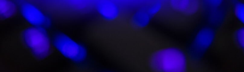 Night dark background bokeh, neon light, blurred background, light effect night view. Dark abstract background, laser glare.