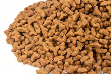 a pile of cat food on white background
