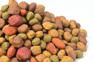 a pile of dog food on white background