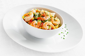 shrimps, cucumber,corn, and bell pepper salad dressed with mayonnaise and decorated with green onion