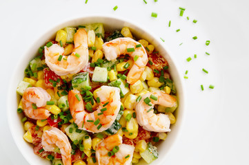 prawns, cucumber,corn, and bell pepper salad dressed with mayonnaise and decorated with green onion
