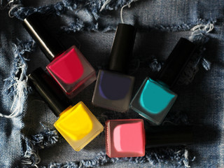 A lot of colored nail Polish and the jeans