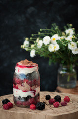 cheese dessert with berries in a jar