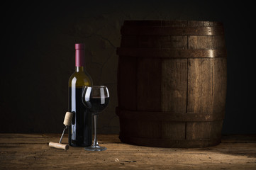Wine tasting experience in the rustic cellar and wine bar: red wine glass and collection of...