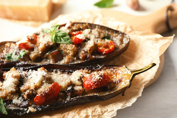 Tasty stuffed eggplants on light table, closeup