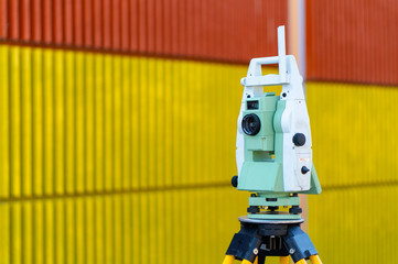 Surveyor equipment (theodolit or total positioning station) on the construction site of the motorway or road