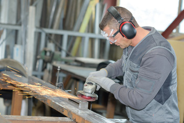 Man using angle grinder