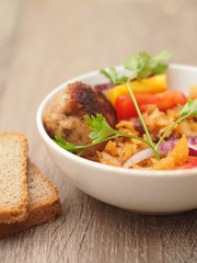 homemade stewed cabbage with salad and chop