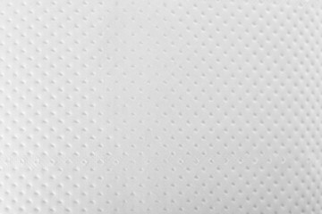 Perforated toilet paper as background, closeup. Personal hygiene