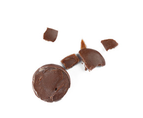 Crushed chocolate candy on white background, top view