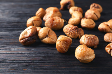 Delicious dried fig fruits on wooden background. Organic snack