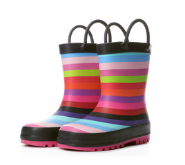 Colorful children's rubber boots on white background