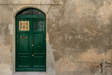 green door on old wall