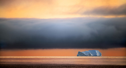 Fototapeta na wymiar Iceberg at sunset. Nature and landscapes of Greenland. Disko bay. West Greenland.