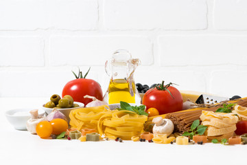 Ingredients for cooking pasta on white background