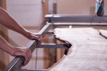 the employee is processing the nutshell. The modern table. bar counter.electric tool