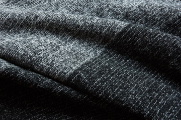 warm gray light dark gradient woolen sweater fabric texture background wool close-up.