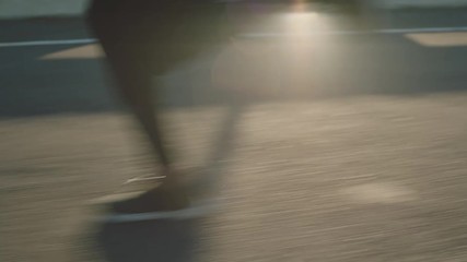 close up athlete legs running on road fit runner jogging sprinting endurance exercise in urban city morning at sunrise