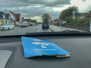 Fototapeta premium Blue parking clock lying in the car