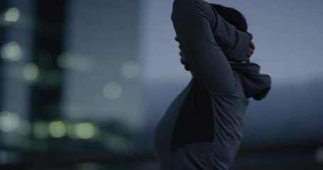 overweight indian woman runner resting exhausted after intense running workout training healthy fitness lifestyle in city at night wearing hoodie - Powered by Adobe