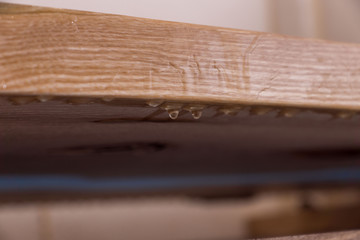 Epoxy resin in cracked walnut massif. drops hang down. furniture loft. modern furnishings. table-tops.