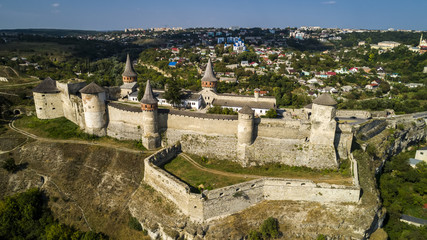 Fototapeta na wymiar Aerial view of old fortress. Stone castle in the city of Kamenets-Podolsky. Beautiful old castle in Ukraine.