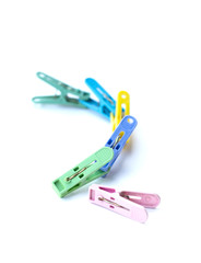 Pile of colorful clothespins isolated on white background
