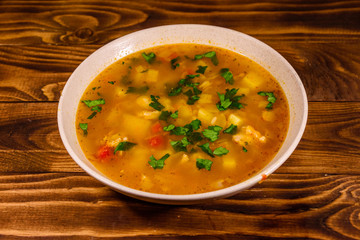 Georgian traditional food soup kharcho on wooden table