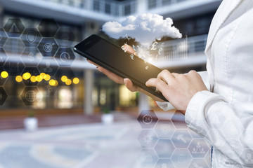 Businesswoman working with financial data in the tablet .
