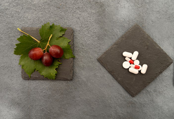 Conceptual dilemma between taking medications or fruits and vegetables.