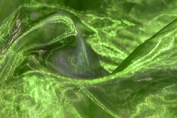 Green-colored cloth as a background for a card.
