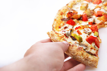 Male hand picking tasty pizza slice, a white background
