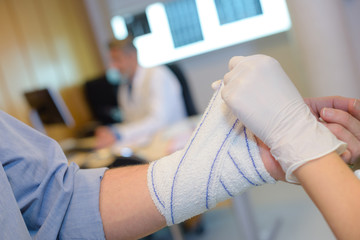 putting bandage around the wrist