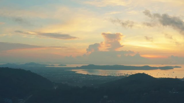 aerial view sunrise in Chalong sea Phuket big Buddha is on the top of Nakkerd mountain.