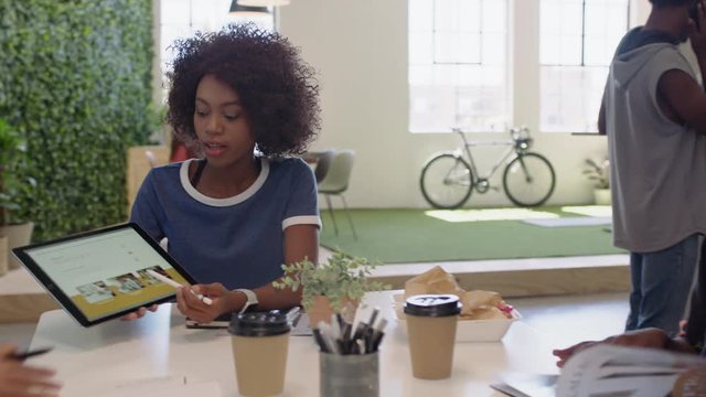 african american business people meeting creative graphic design team brainstorming marketing ideas team leader woman using tablet computer technology in office boardroom sharing strategy