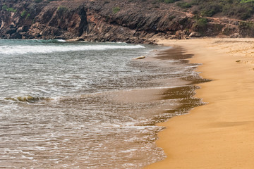 A beautiful pattern of sea water with foam created  after collide sea water wave at sea shore.