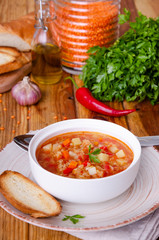 Spicy soup with red lentils, tomatoes, leek, bell pepper, carrots and potatoes.