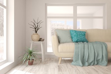 White room with sofa and winter landscape in window. Scandinavian interior design. 3D illustration