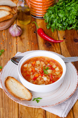 Spicy soup with red lentils, tomatoes, leek, bell pepper, carrots and potatoes.