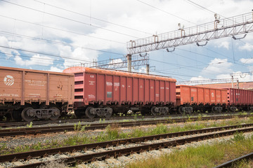 Fototapeta na wymiar Trains with goods and freight cars are on the railway