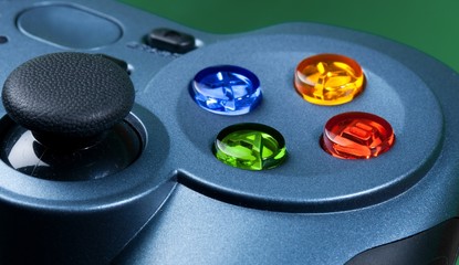 Obraz na płótnie Canvas Blue Gamepad with Colored Buttons - Close Up