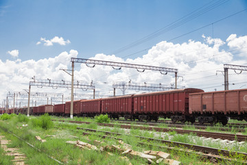 Fototapeta na wymiar Trains with goods and freight cars are on the railway