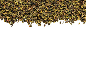 Chinese green teguanin tea, scattered on a white background, poured with a tea spatula and a tea filter.