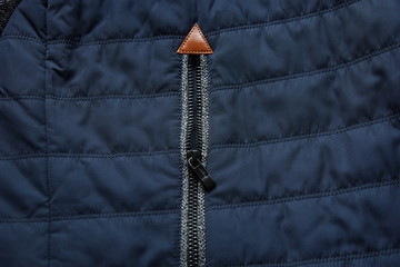 warm blue dark zipper jacket fabric texture background close-up © Konstantin