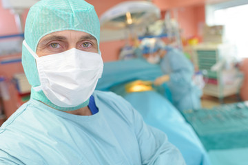 male surgeon preparing for operation in operation room
