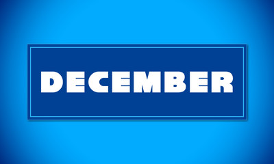 December - clear white text written on blue card on blue background